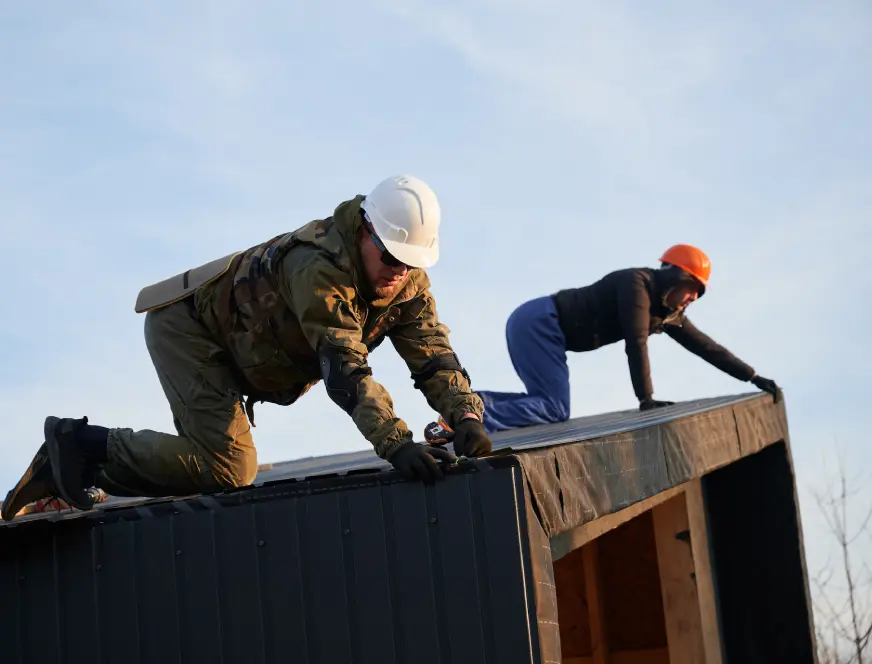builder-installing-corrugated-iron-sheet-used-as-f-2023-11-27-05-35-32-utc-2.webp